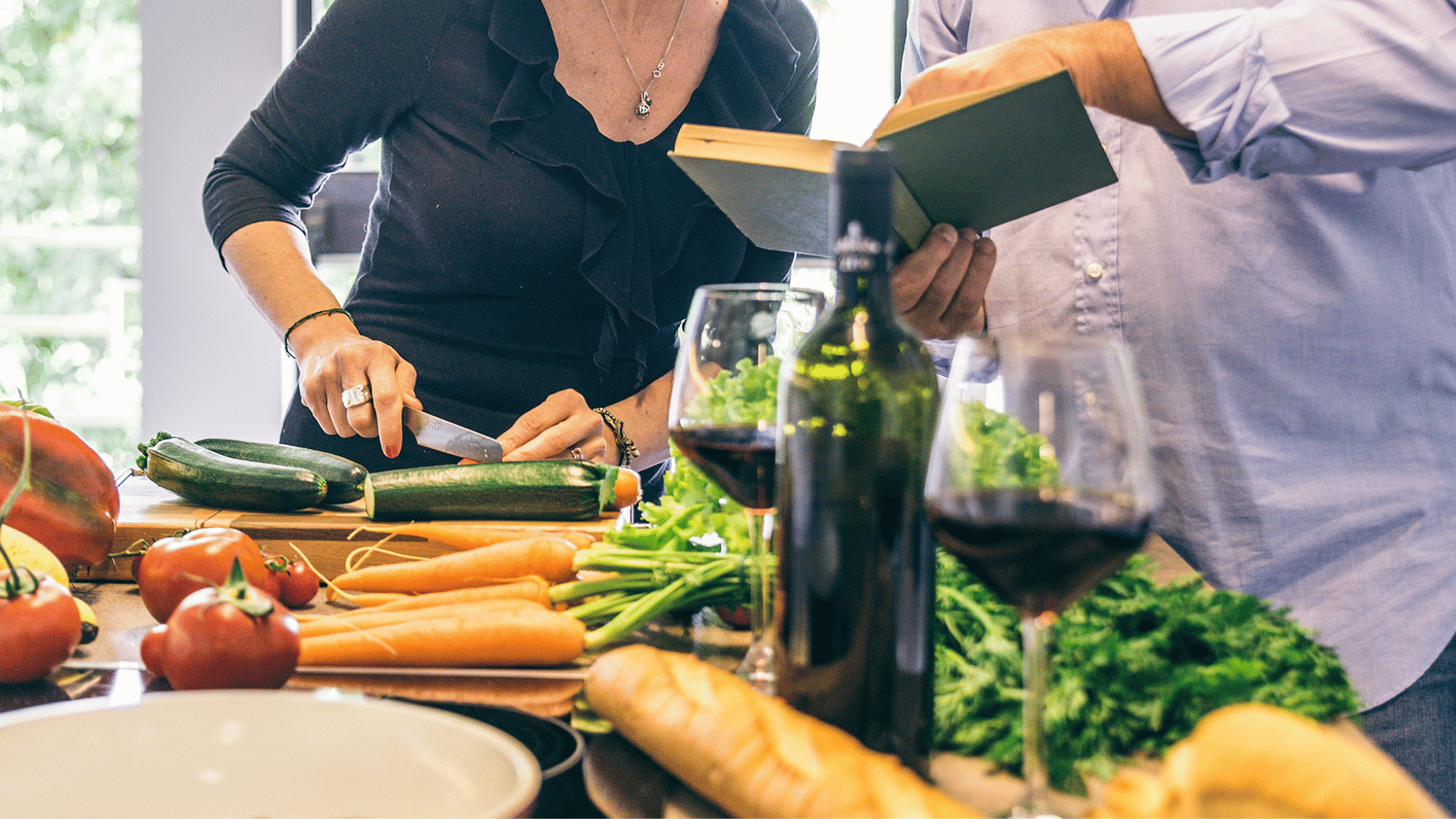 Family members around a table sharing food memories and stories with Recipe Memory
