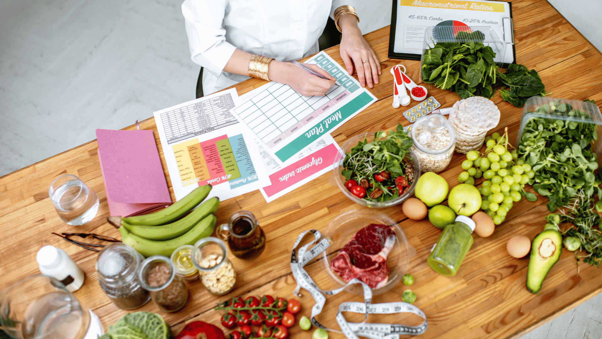 Organized weekly meal planner alongside fresh produce and prepared dishes