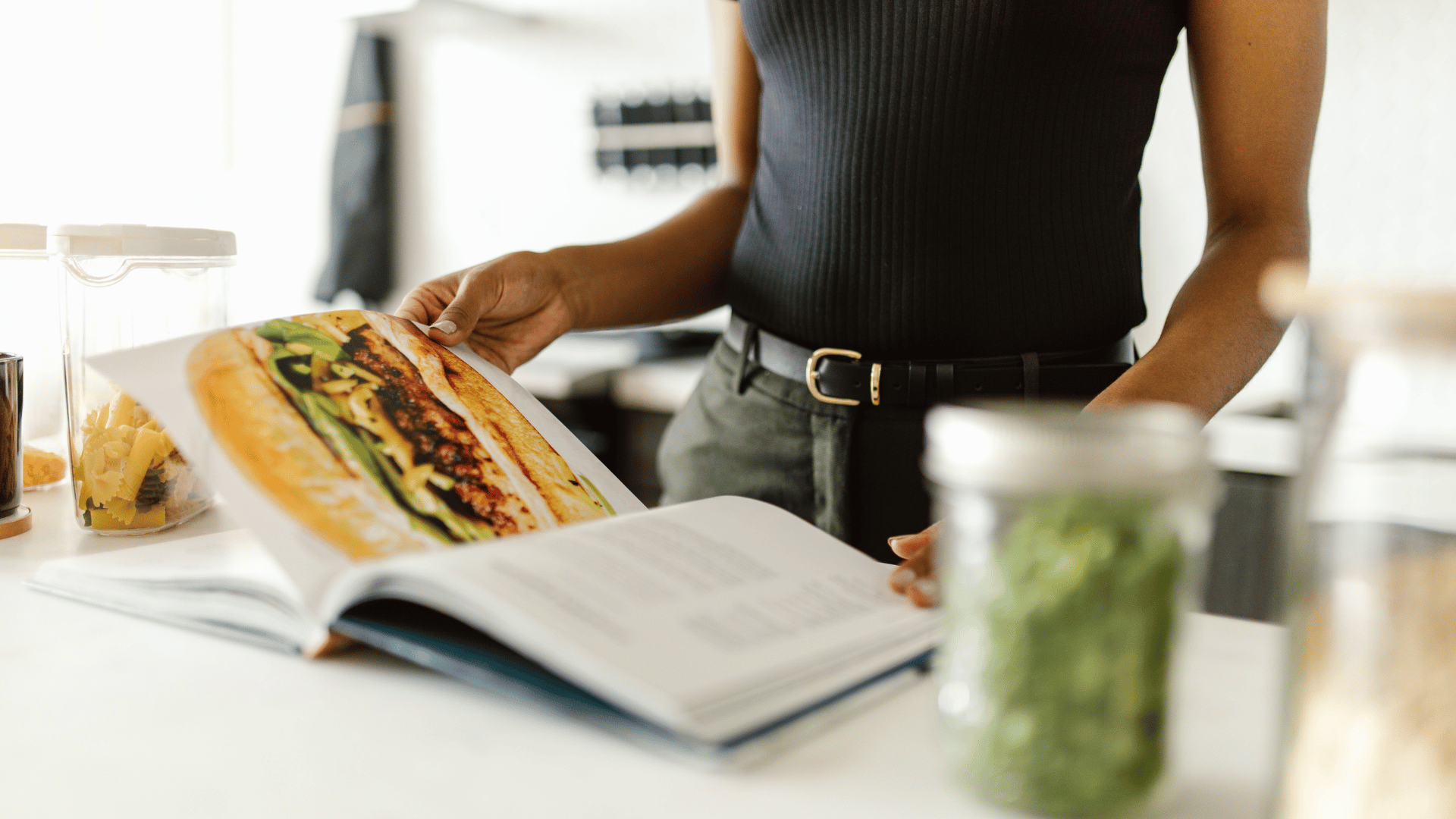 Recipe randomizer on a phone offering a dinner suggestion surrounded by fresh ingredients