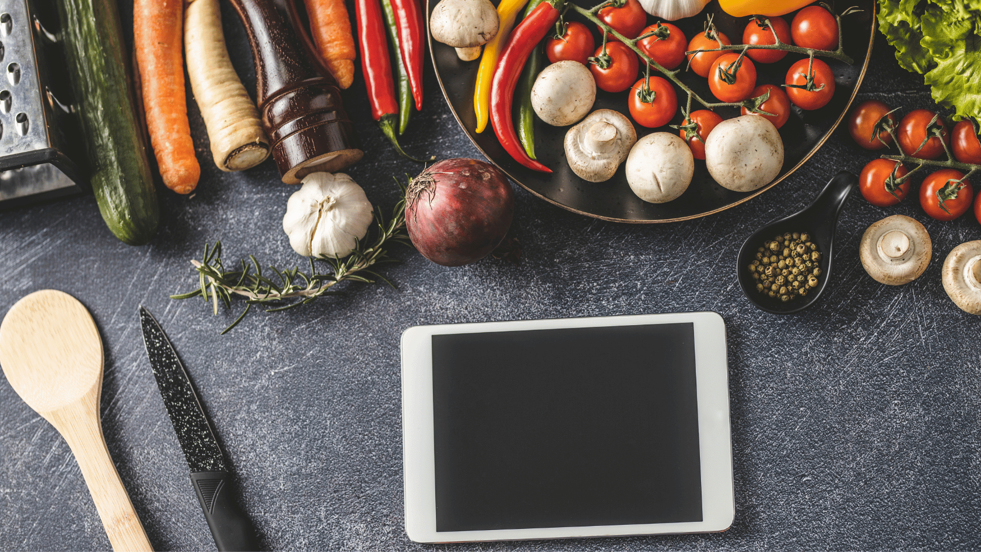 Vintage recipe cards alongside a tablet showing preserved digital heirloom recipes with Recipe Memory