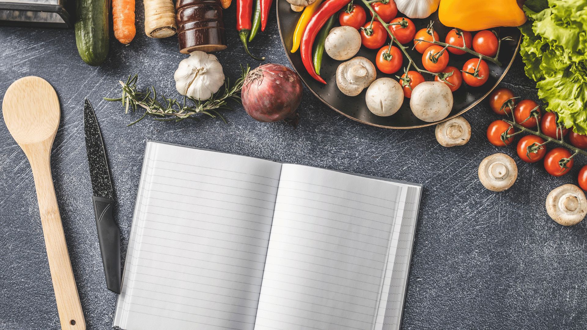 Open recipe book with blank pages surrounded by ingredients Recipe Memory
